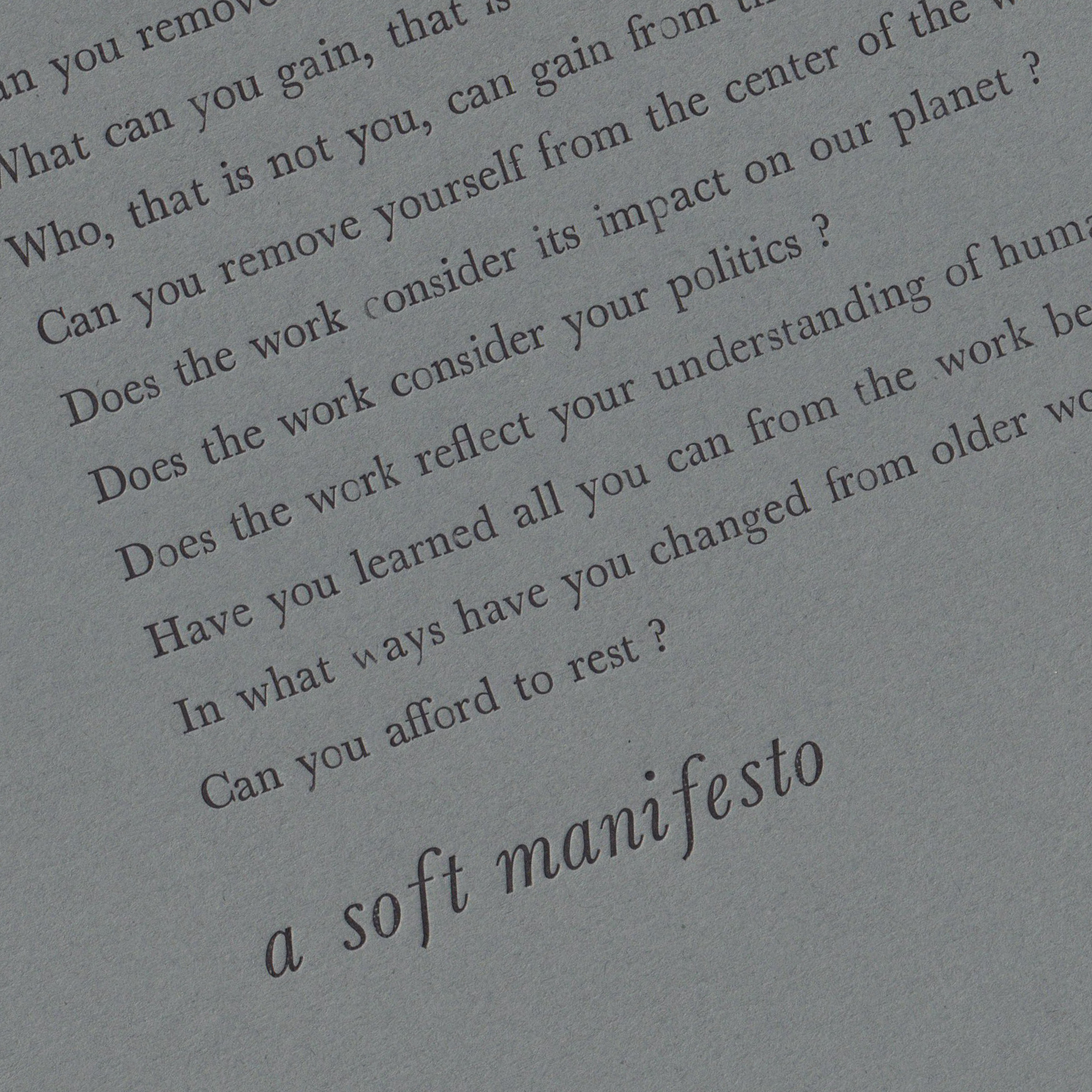 manifesto text letterpress printed with black ink on dark paper