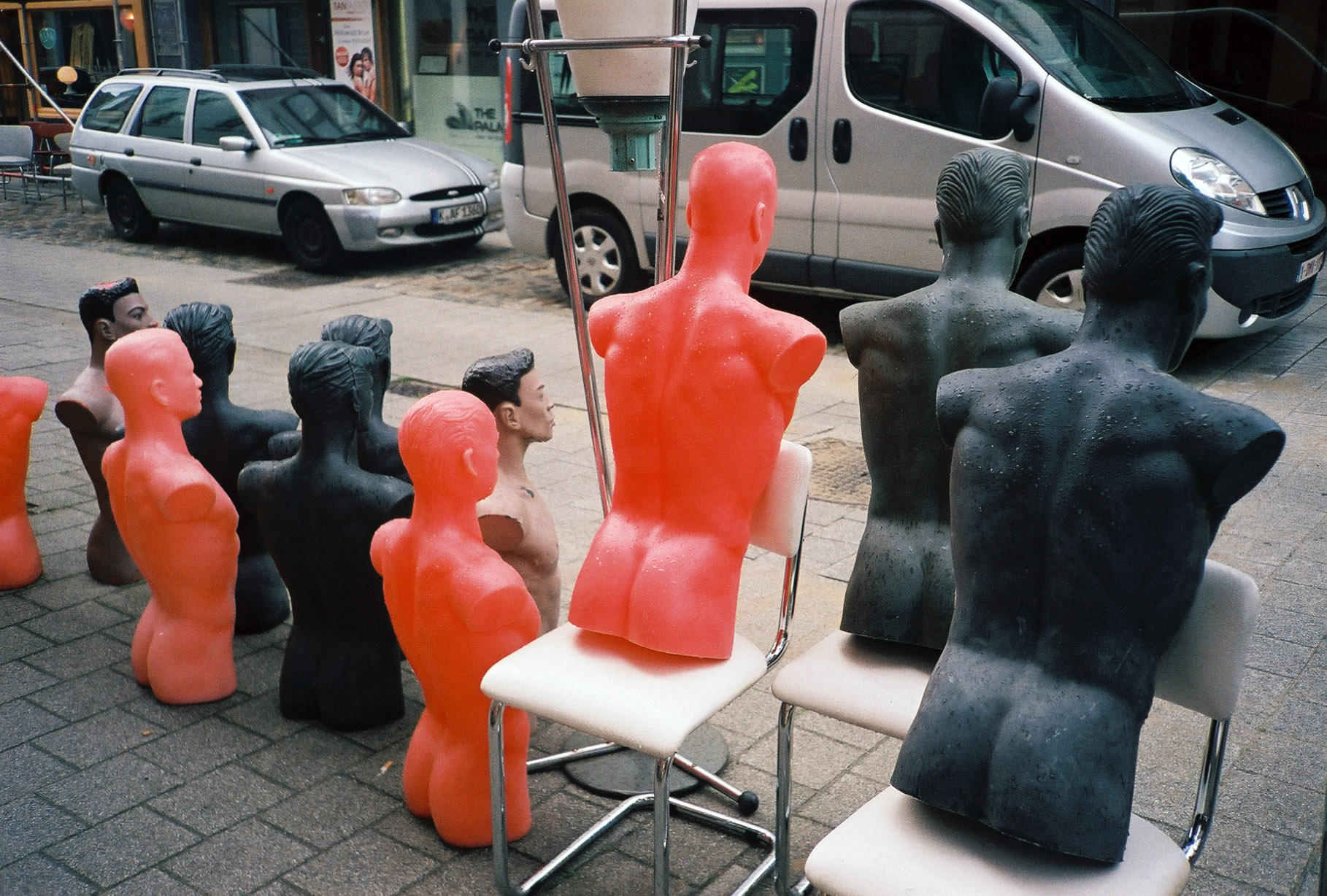backside view of a group of display mannequins without arms or legs
